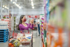 Female Adult Reading the Nutrition Label of a Food Item