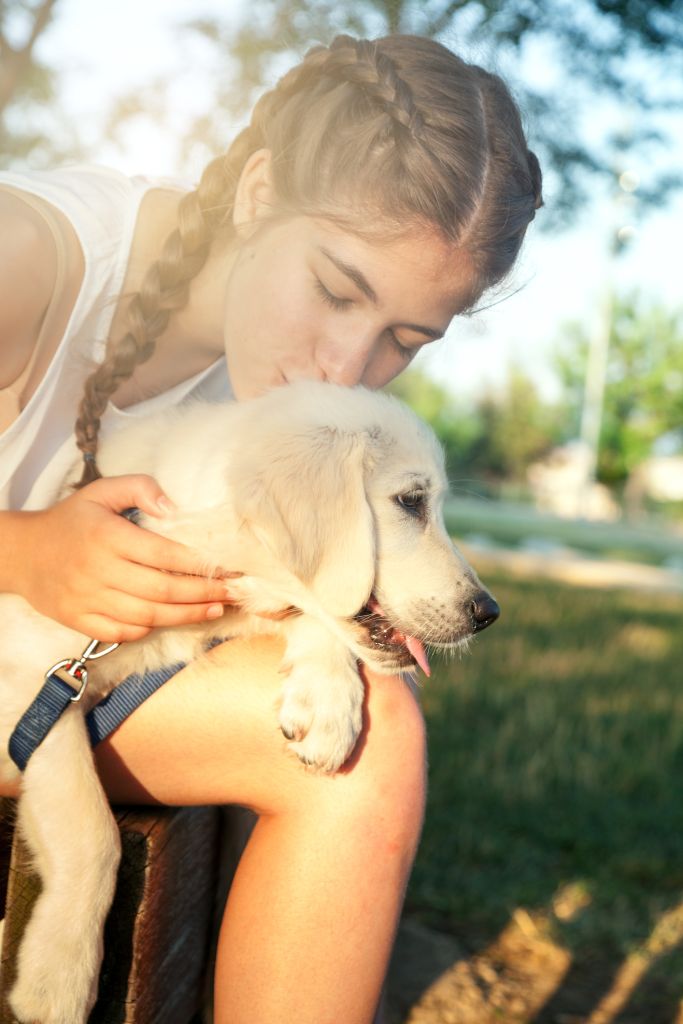 Teen girl and her puppy dog