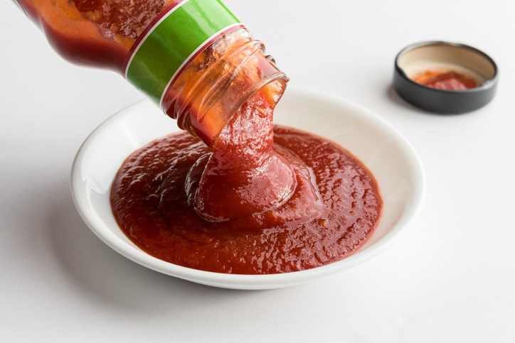 Close-Up Of Ketchup Over White Background