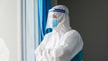 Doctor wearing protective suit to fight coronavirus pandemic covid-2019.