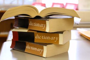 Stack of dictionaries on a desk
