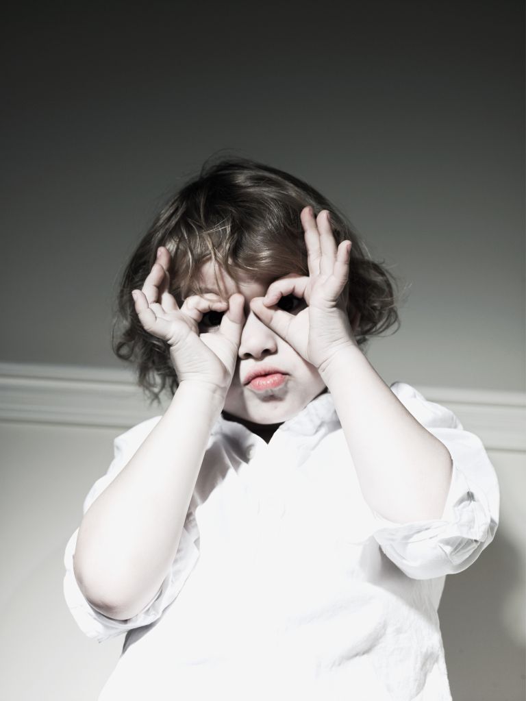 Young boy making a funny face.