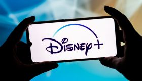 In this photo illustration a Disney Plus logo seen displayed...