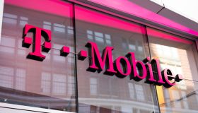 German telecommunications company, T-Mobile store logo seen...