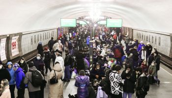 Kyiv residents seen at a metro station as they take shelter...