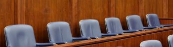 Empty Jury Seats in Courtroom