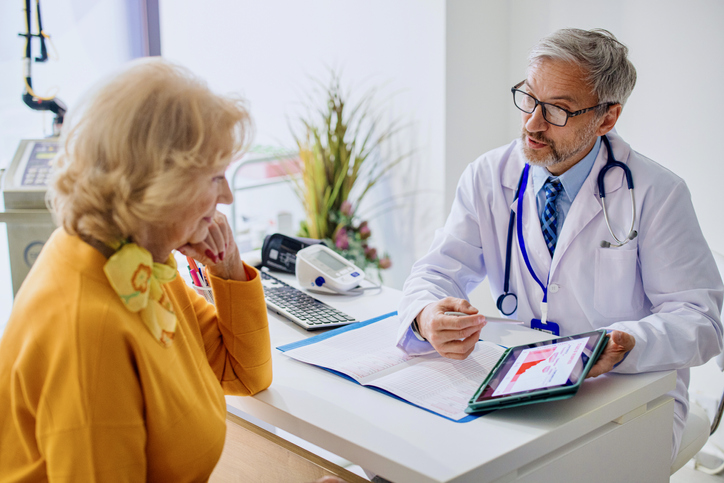 Doctor explaining hormone replacement therapy to his patient