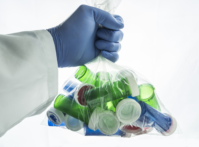 Doctor holding a bag of medical bottles