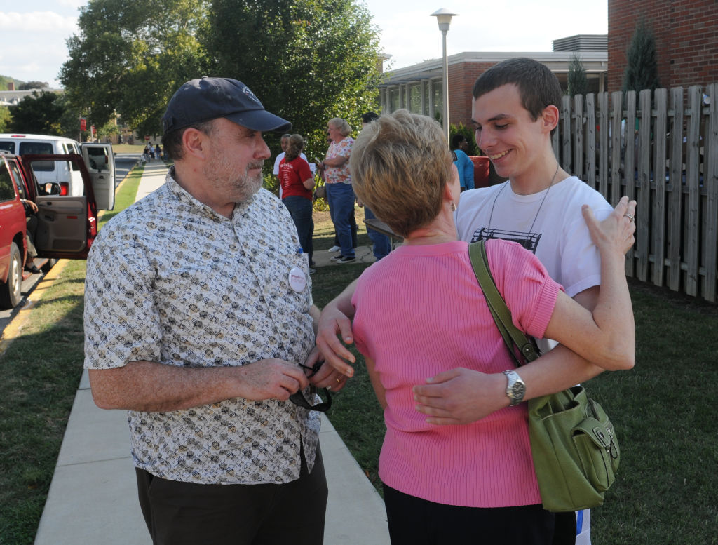 8/26/2010 Reading, PA Thomas Callahan hugs his mother Susan Callahan as his father Tim Callahan looks on. At Albright College Thursday afternoon where parents were saying goodbye to their children after dropping them off for the beginni