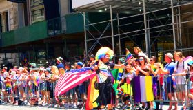 NYC Pride March 2022, Colorful marcher with Rainbow and American flags, Manhattan, New York City