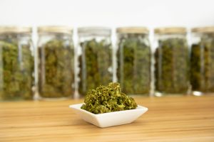 Dry cannabis buds, stored in a glass jars