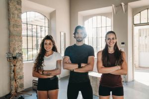 Portrait of three athletes in a gym health club