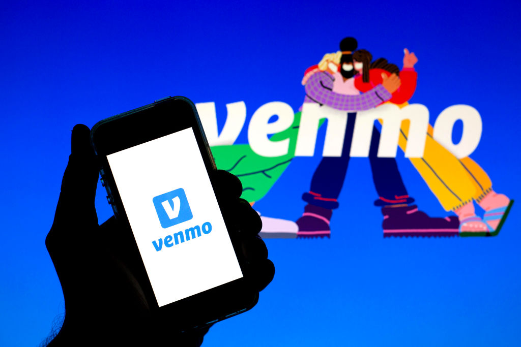 In this photo illustration a Venmo logo seen displayed on a...