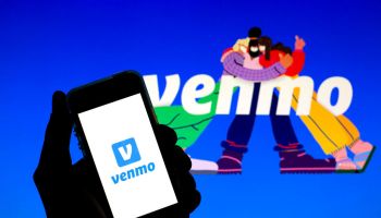 In this photo illustration a Venmo logo seen displayed on a...