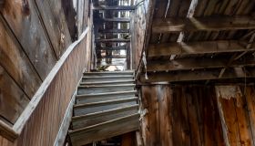 Broken staircase in an old building in a ghost town