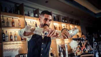 Bartender preparing cocktails and coffee