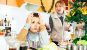 Woman quarreling with daughter during cooking christmas dinner