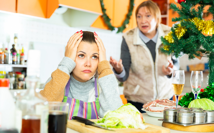 Woman quarreling with daughter during cooking christmas dinner