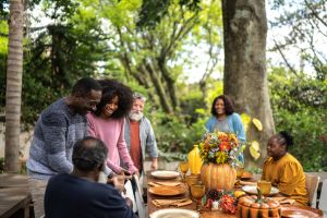 Family or friends greeting each other on Thanksgiving at home