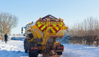 Gritter Starting Work on Treacherous Snowy and Icy Rural Road in the UK