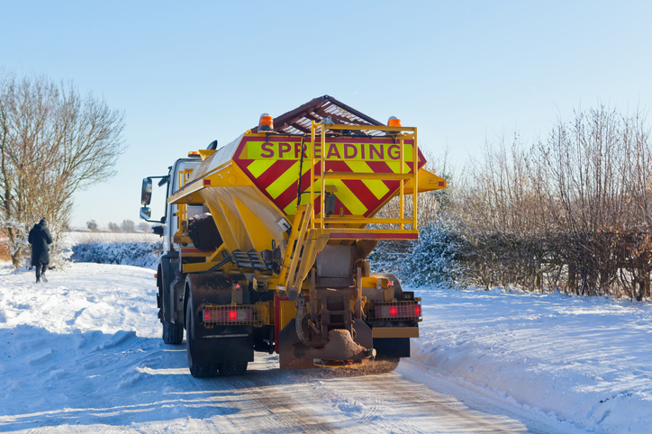 Gritter Starting Work on Treacherous Snowy and Icy Rural Road in the UK