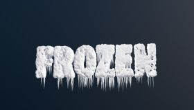Alphabets FROZEN covered with snow, ice and icicles on dark background. Illustration of the concept of blizzard, winter, coldness and snowfall