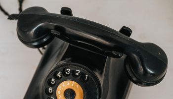 Old antique black bakelite rotary phone. Vintage