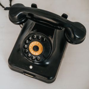 Old antique black bakelite rotary phone. Vintage