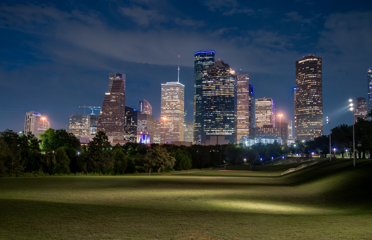 Low Angle View of Wide Open Field With the City of Houston Texas Skyline in the background