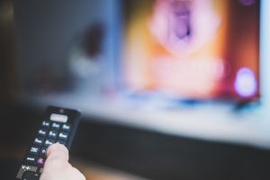 Hand with tv remote