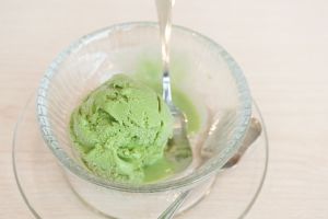 Green tea ice cream. A scope of Japanese matcha green tea ice-cream.