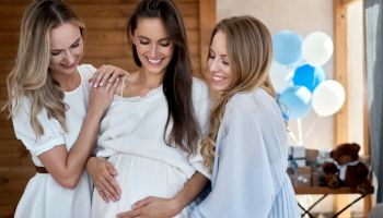 Group of smiling adult women at baby shower