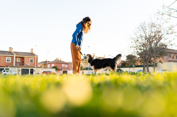 woman with her dog in the park