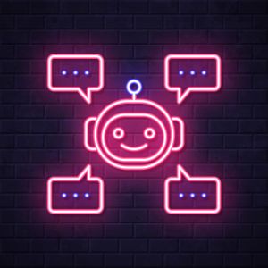 Chatbot with speech bubbles. Glowing neon icon on brick wall background