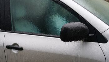 car coated ice crust during the icy rain in cold weather