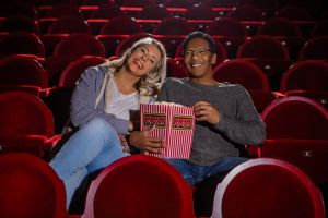 Theatre going couple at the cinema together