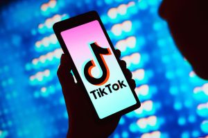 In this photo illustration, the TikTok logo is displayed on...