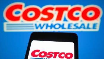 In this photo illustration, the Costco Wholesale logo is...