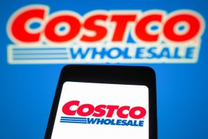 In this photo illustration, the Costco Wholesale logo is...