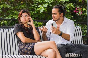 Young woman looks to the side in disappointment