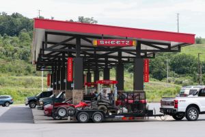 Vehicles are seen at the gas pumps of a Sheetz convenience...